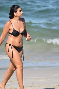 Thick mature brunette bikini lady on the beach with a nice body
