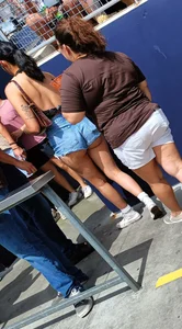 Latina MILF in orange leggings plus booty shorts
