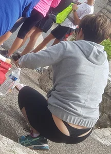 Short haired milf sitting showing her thong