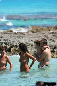 Nude beach ladies in the water showing their tits