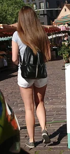 Pretty blonde babe with nice legs in white denim shorts