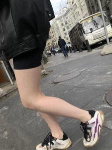 Very hot legs of a candid girl wearing a leather jacket