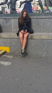 Girl with Nice Legs Sitting on the Monument Pedestal - City Candid