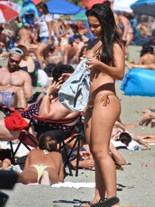 Pretty brunette in a bikini at the beach