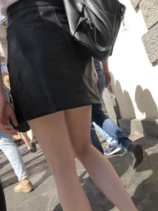 Hot redhead chick wearing leather skirt, nice pale legs