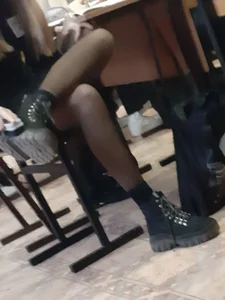 Legs of candid college teens wearing pantyhose in class