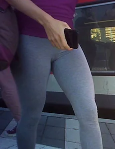 Hot chick's legs and crotch in grey leggings at the public train station closeup creepshot