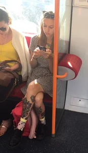 Girl with Tattoos in a Bus