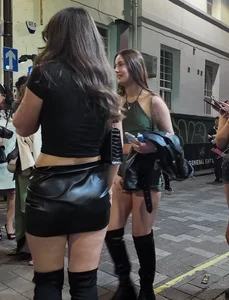 Very pretty girl in short leather skirt and high boots (not OC)