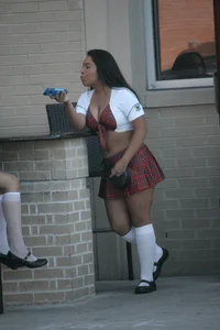 Two sexy Tilted Kilt employees showing cleavage and cheeks