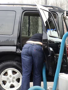 Girls cleaning their cars in jeans and pants