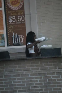 Sexy ebony Tilted Kilt employee in her uniform