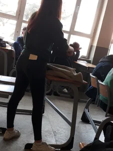 Teen Female Student In Tight Jeans With a Phone In Her Back Pocket, Photos in Class