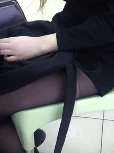 Young Girl Sitting at a Desk in Class
