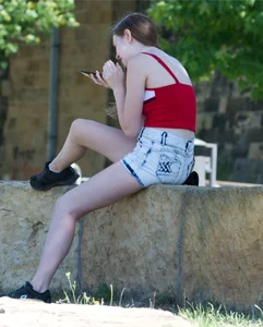 Pretty candid girls with nice legs sitting in denim shorts