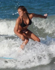 Hot surfer chicks out in the water