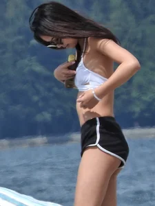 Blondie and two asian girls put on sunscreen (pt 2) [062]