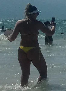 Big booty white chick in a yellow thong at the beach
