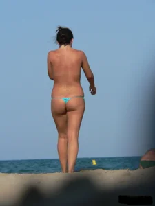 2 topless thonged sexy friends on the beach with great bodies