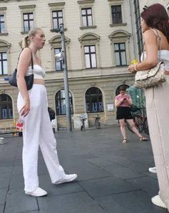 Long blonde braless in a white outfit (many pictures)