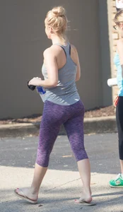 Sexy blonde out walking in purple leggings with a nice ass