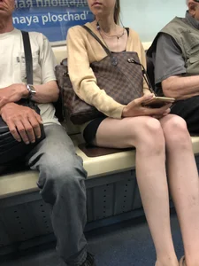 Very Skinny Girl Wearing Glasses with Long Legs in a Short Skirt Falling Asleep in a Subway Train Candid