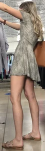 Basic blonde in a dress shopping for her man