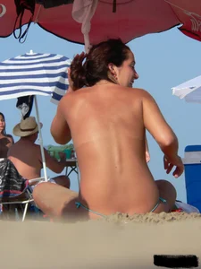 2 topless thonged sexy friends on the beach with great bodies