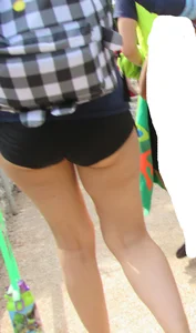 Girl with slight cheeks in little spandex shorts
