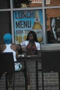 Sexy ebony Tilted Kilt employee in her uniform