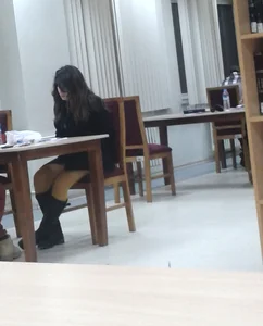 Candid Girl in Pantyhose And Boots Working at the Desk in a Public Library Creepshots Gallery