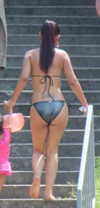 Sexy brunette milf in a bikini with a great body, nice ass and some camel toe