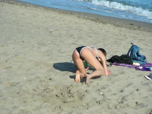 Hot girl playing tennis at the beach