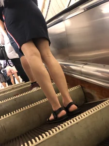 Hot Legs in a Skirt and Sandals on the Subway Escalator Closeups