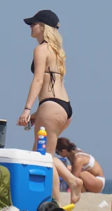 Two thick white girls in bikinis on the beach with big asses