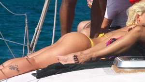 Big booty blonde babes on the beach in little thong bikinis