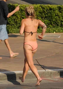 Sexy blonde with a nice ass in a peach bikini