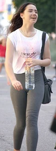 Brunette girl in grey leggings showing her mound, slight camel toe and gap