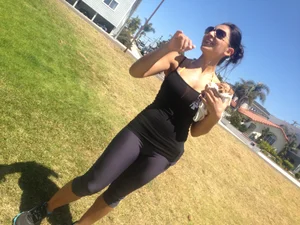 Hot brunette babe in leggings walking her dog with a nice ass and some cleavage