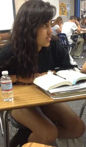 Cute College Girl’s Legs Under Desk Photo in Classroom