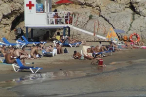 Girls on a nude beach in Sitges, Spain
