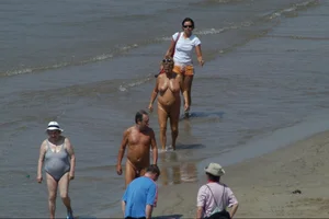 Girls on a nude beach in Sitges, Spain