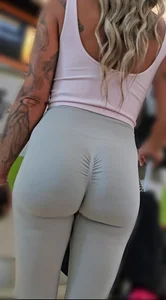 Fit blonde in grey leggings with a Fat Ass