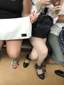 Cute candid girl with pale sexy legs sitting in subway train creepshots