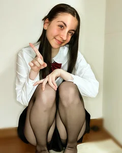 Girl in black pantyhose and a skirt