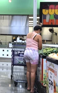 Thick Latina babe with a nice ass in tight patterned shorts