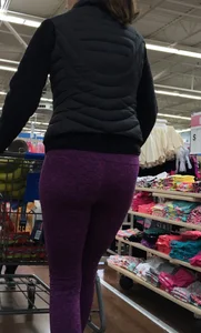 Milf shopping with a nice ass in purple leggings