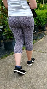 Milf booty in tight leggings shopping for plants