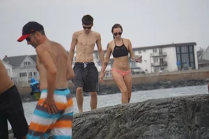 Peach bikini tattood babe on the beach with a nice ass and some camel toe