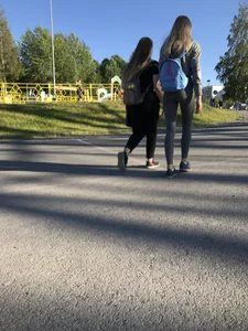 Skinny Girl in Grey Leggings Walking Past the Camera Candid Photos Gallery